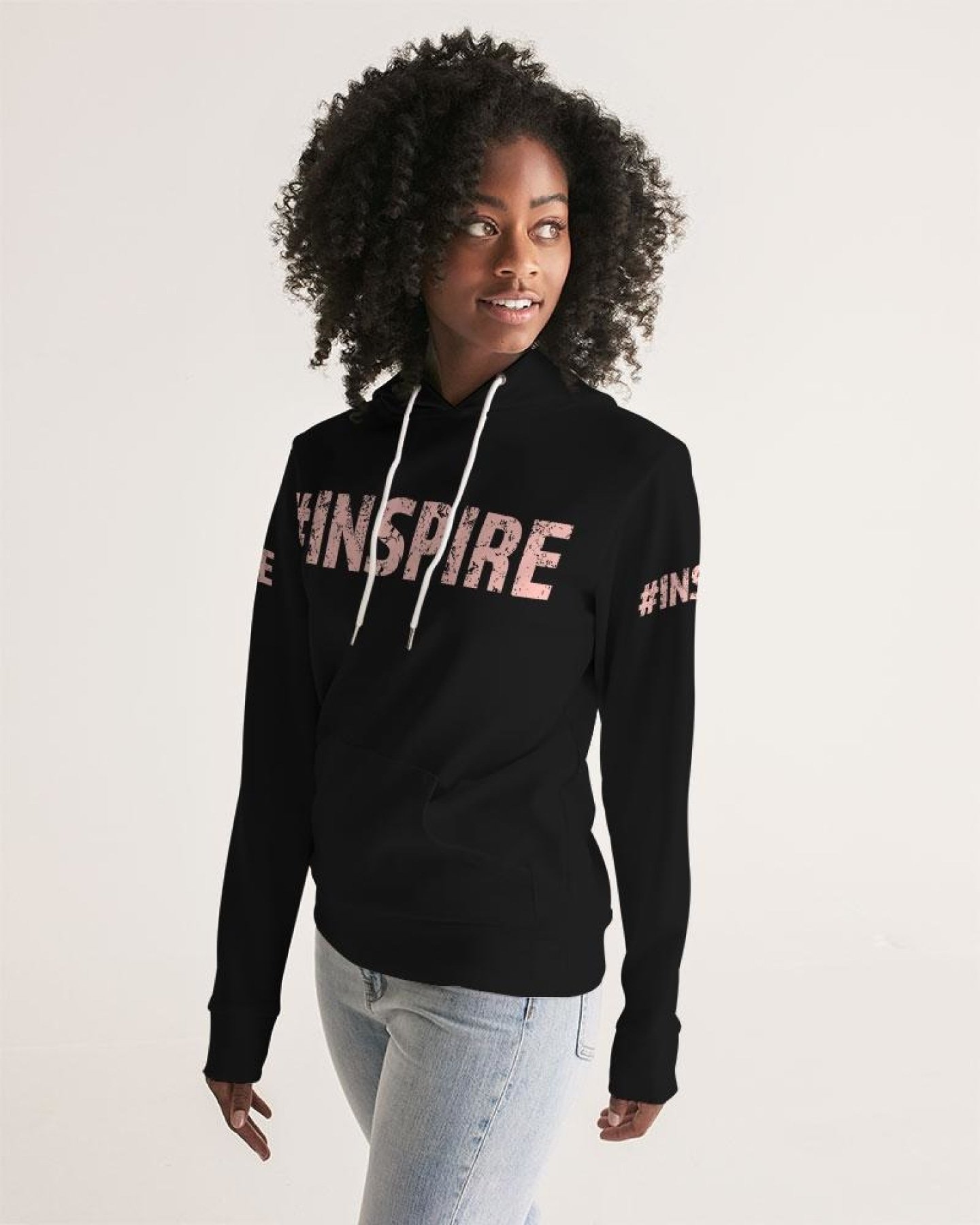 Women's pullover hoodie in peach with graphic design, featuring adjustable drawstring hood and front pocket.