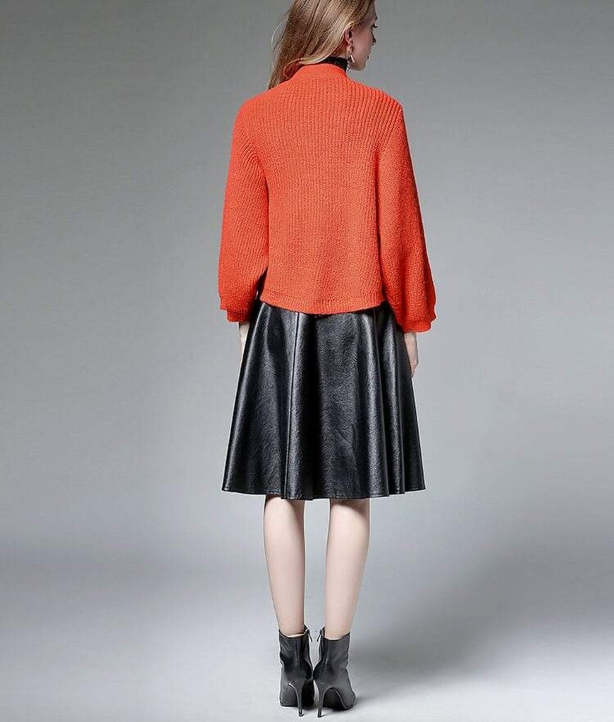 Womens Short Batwing Cardigan in red and black, showcasing its loose fit and stylish design.