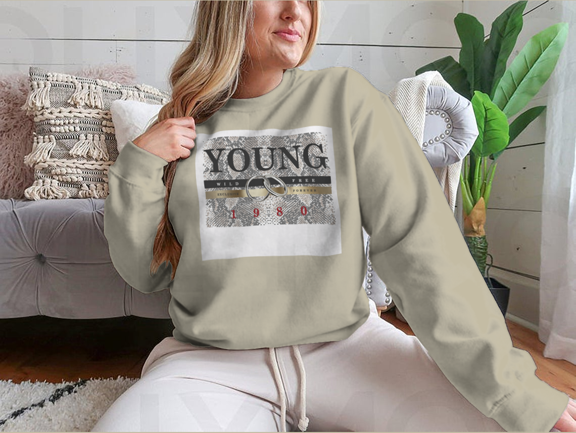 Stylish Young Slogan T-shirt featuring a snake skin pattern background and elegant gold foil print.