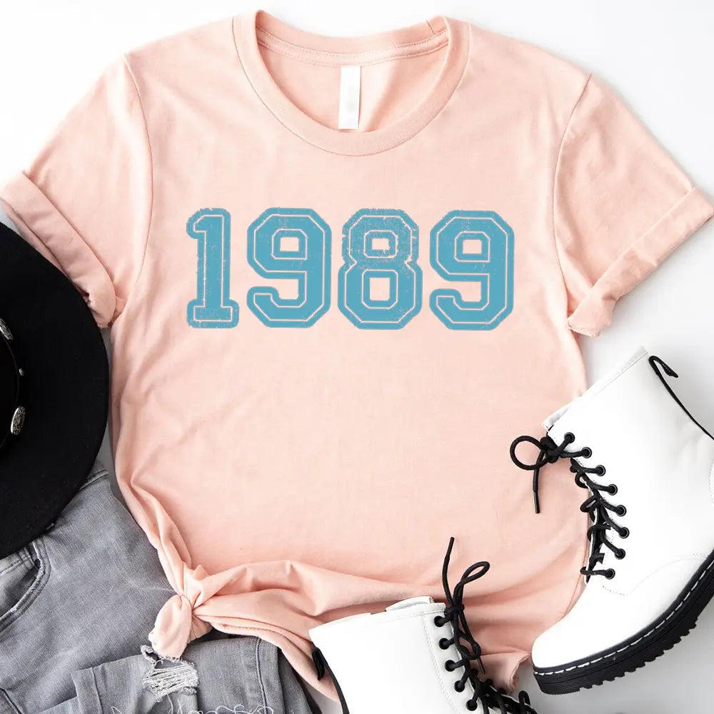 A stylish 1989 Tay's Birthday T-shirt featuring a modern classic fit, made from soft ringspun cotton, perfect for celebrations.