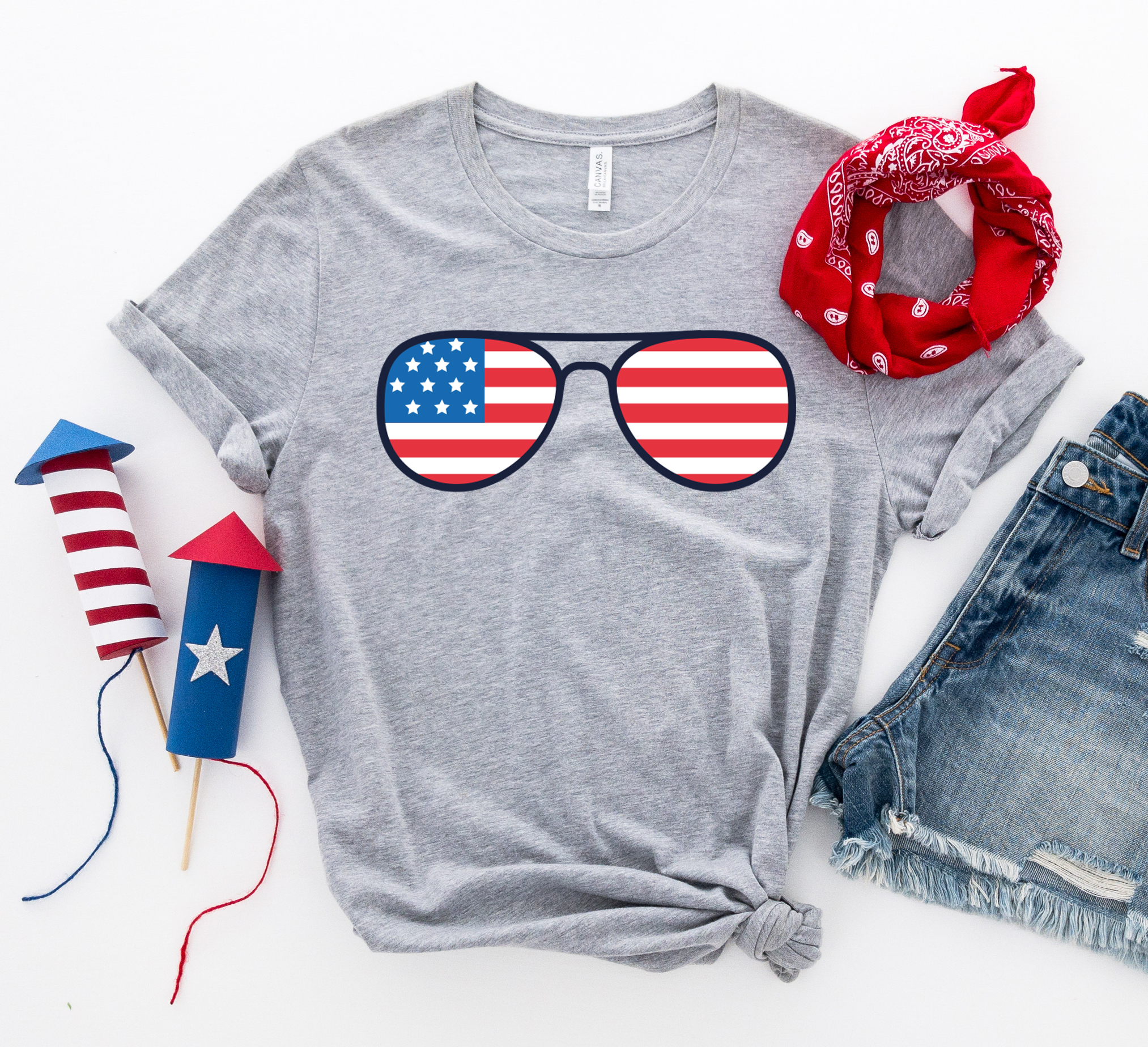 A stylish 4th of July Sunglasses T-shirt featuring a vibrant design, made from premium ring spun cotton for comfort and durability.