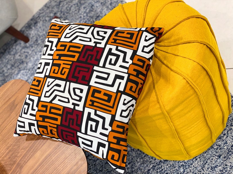 A pair of handmade African mudcloth pillow covers featuring intricate tribal patterns on soft cotton fabric, perfect for home decor.
