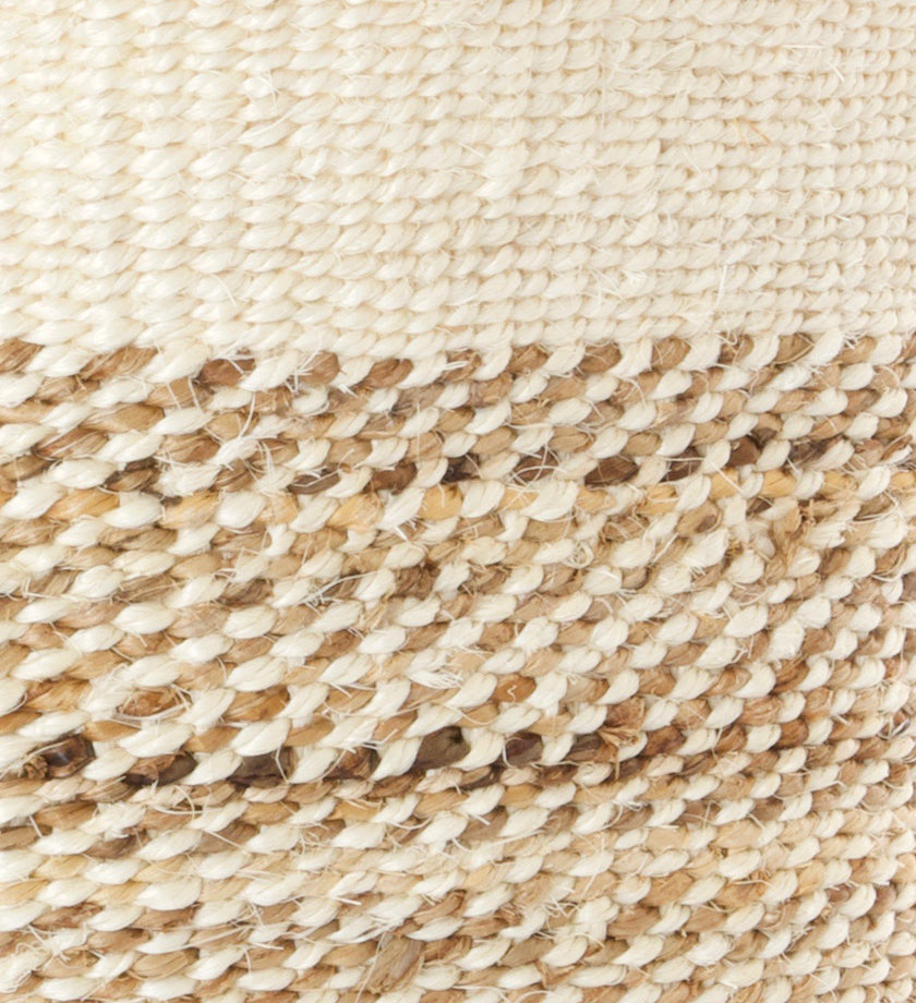 A beautifully handcrafted African natural fibre basket bin made from sisal and banana fibers, showcasing unique textures and patterns.