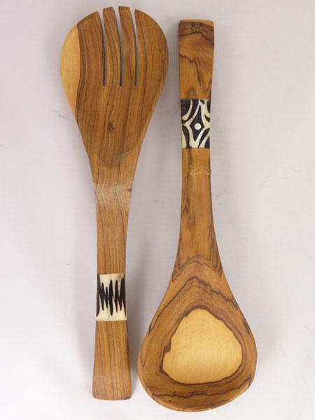 Hand-carved African olive wood salad serving set with batiked bone inlay, showcasing unique patterns and natural wood grain.