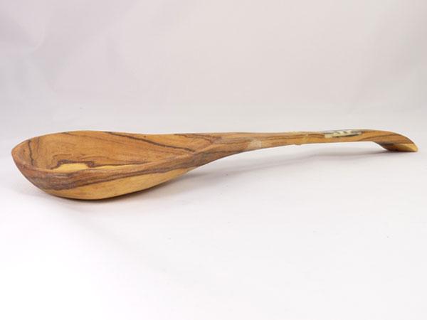 Hand-carved African olive wood salad serving set with batiked bone inlay, showcasing unique patterns and natural wood grain.