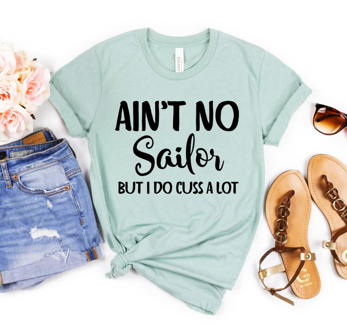 Ain’t No Sailor But I Do Cuss a Lot T-Shirt displayed on a mannequin, showcasing its humorous design and premium quality fabric.