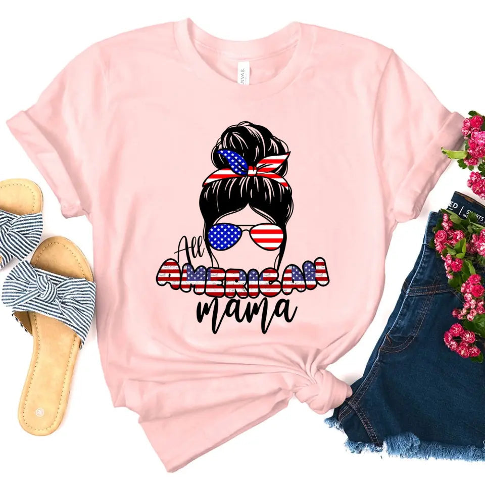 All American Mama 4th Of July Mom T-shirt featuring bold patriotic graphics on a soft ringspun cotton fabric.