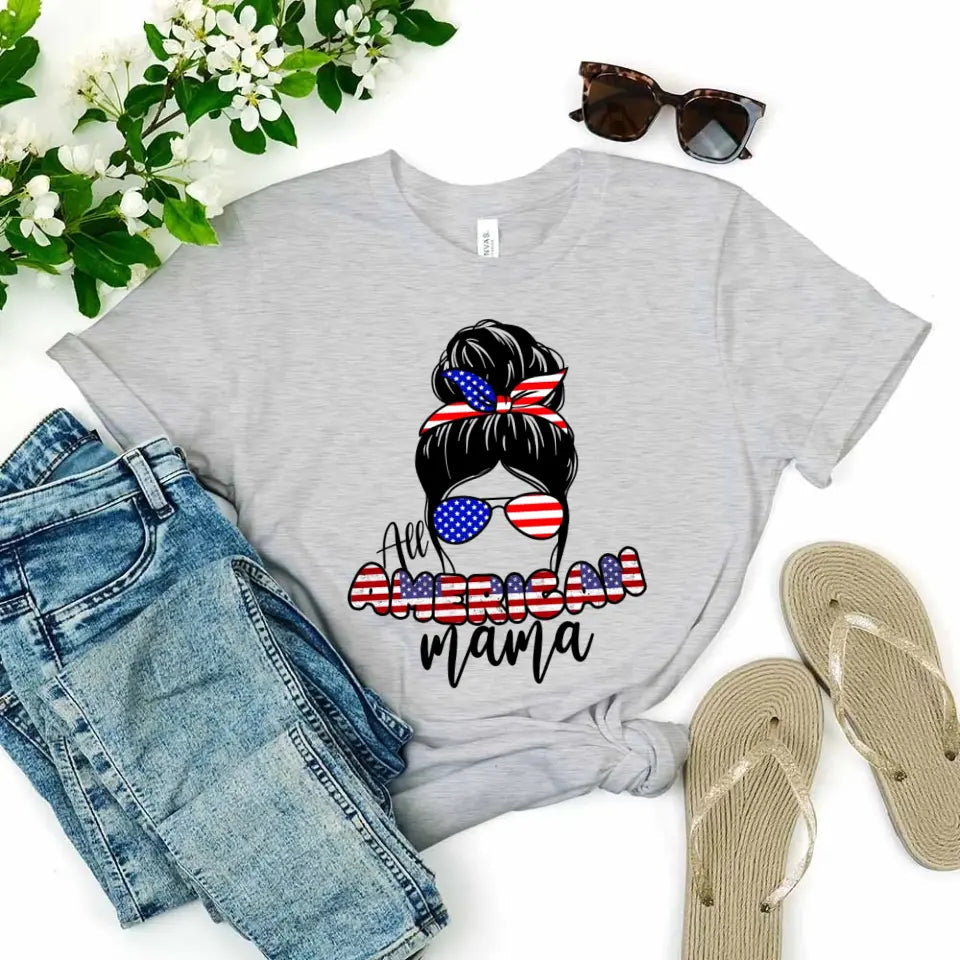 All American Mama 4th Of July Mom T-shirt featuring bold patriotic graphics on a soft ringspun cotton fabric.