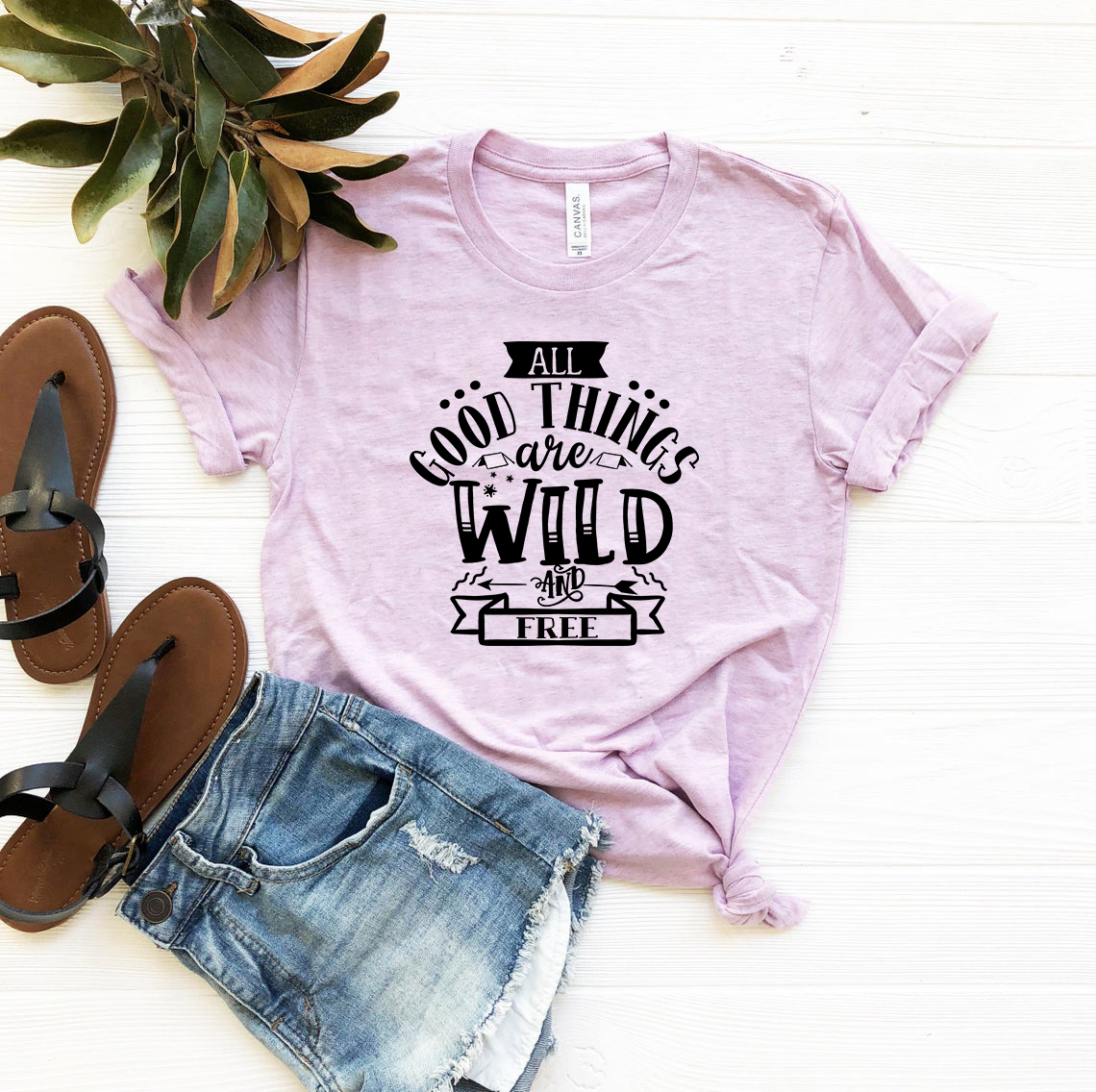 Unisex T-shirt featuring the phrase 'All Good Things Are Wild And Free' in a stylish design, available in multiple colors.