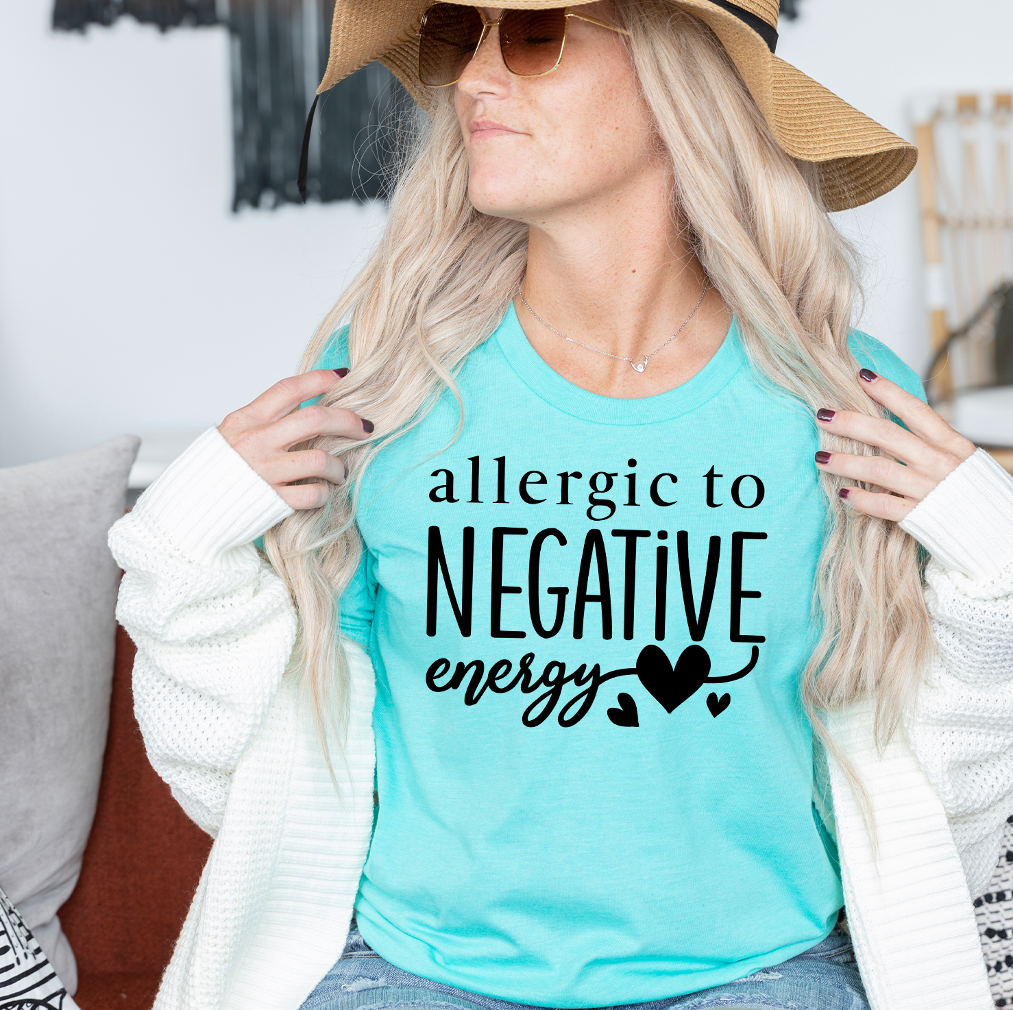 A stylish unisex t-shirt featuring the phrase 'Allergic To Negative Energy' printed in vibrant colors, showcasing a modern design.