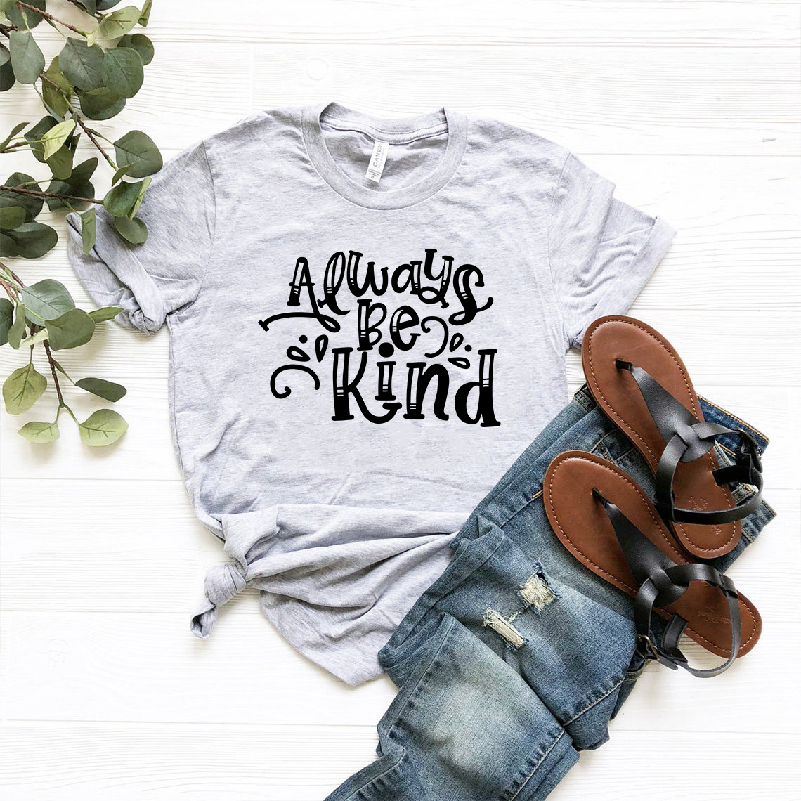 A unisex Always Be Kind Shirt made from soft ring spun cotton, featuring a crew neck and available in multiple colors and sizes.
