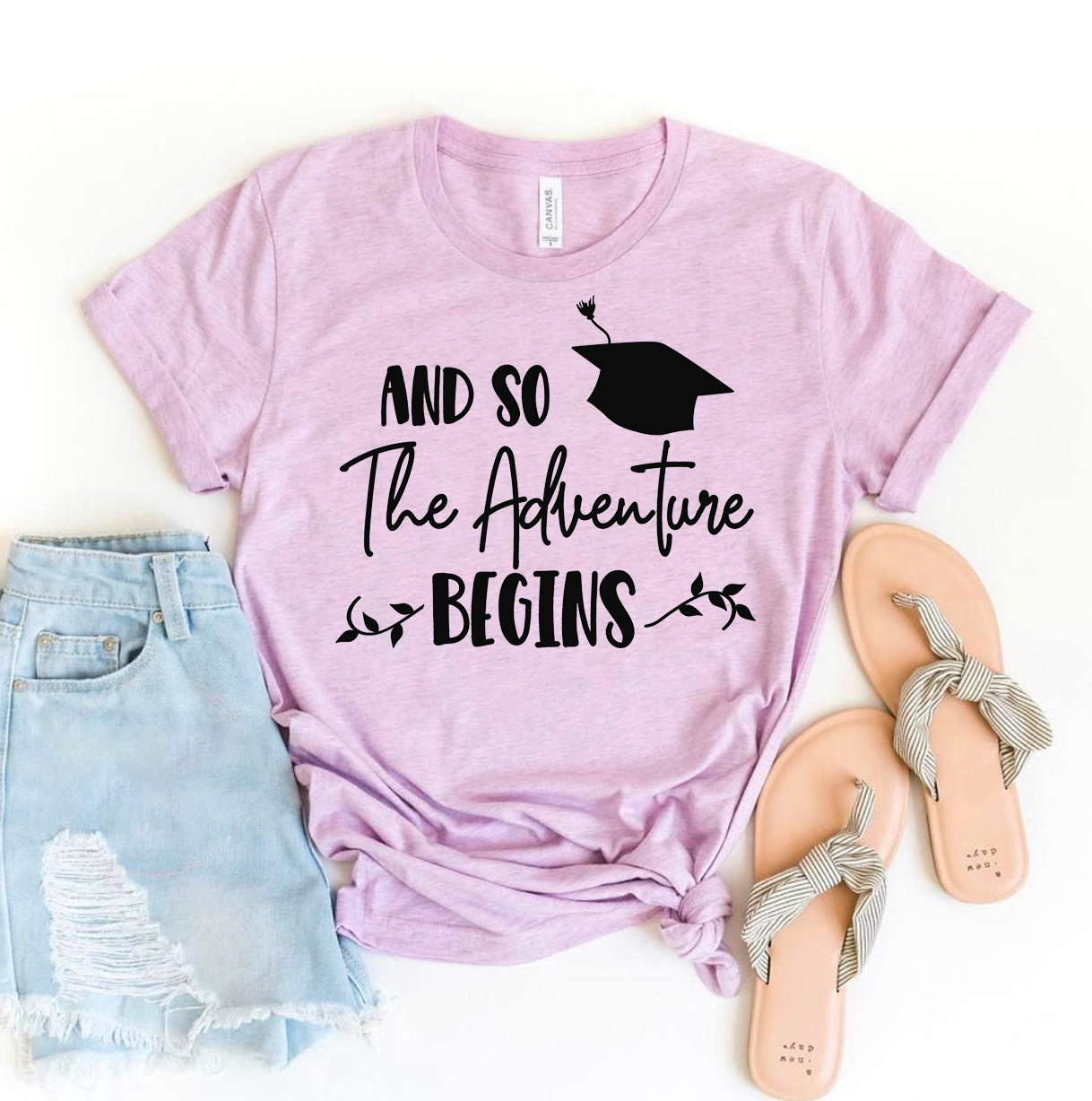 A stylish 'And So The Adventure Begins' T-shirt made from premium ring spun cotton, featuring a high-quality flex print design.