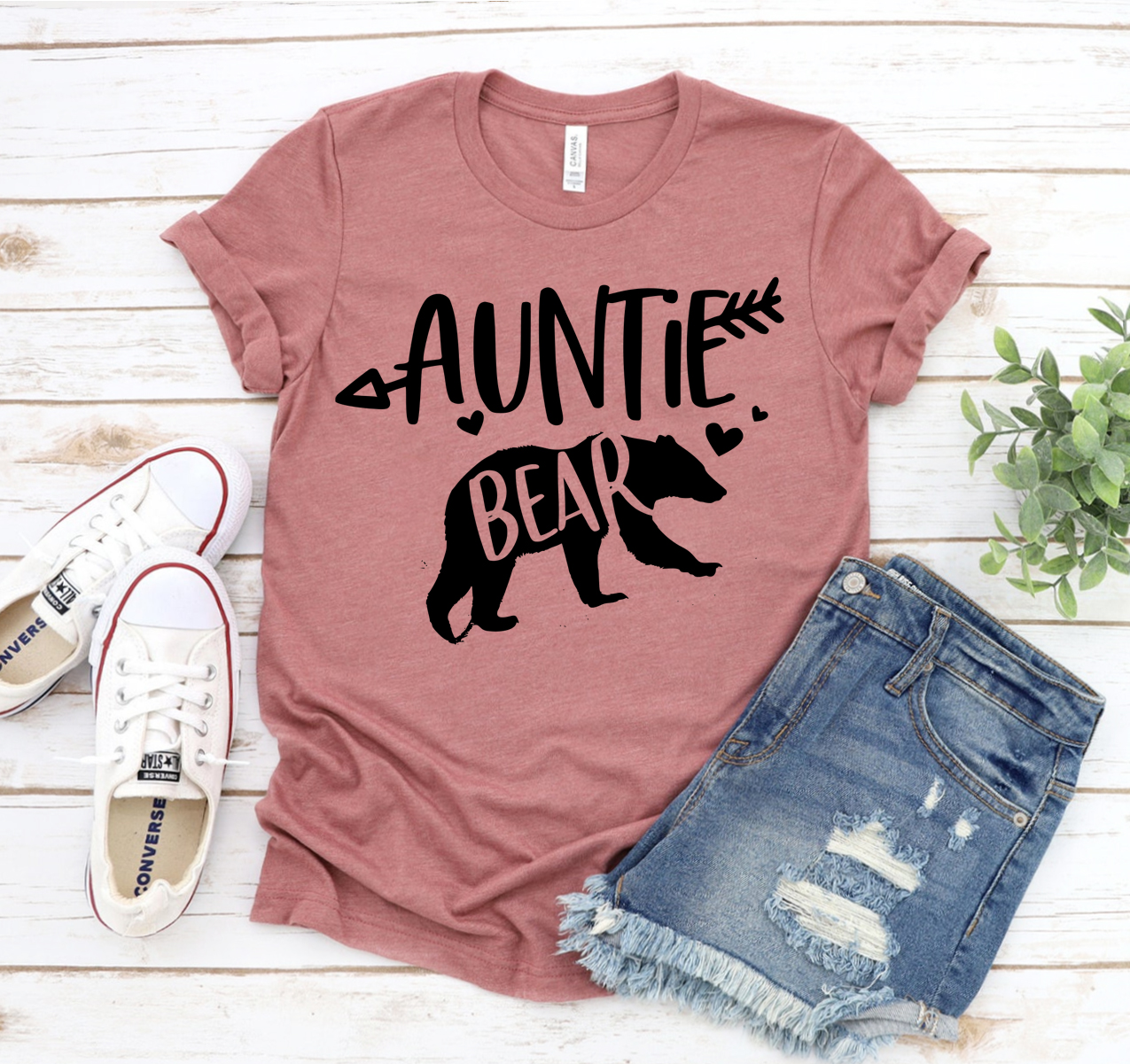 Auntie Bear T-shirt displayed on a hanger, showcasing its soft fabric and classic unisex design.