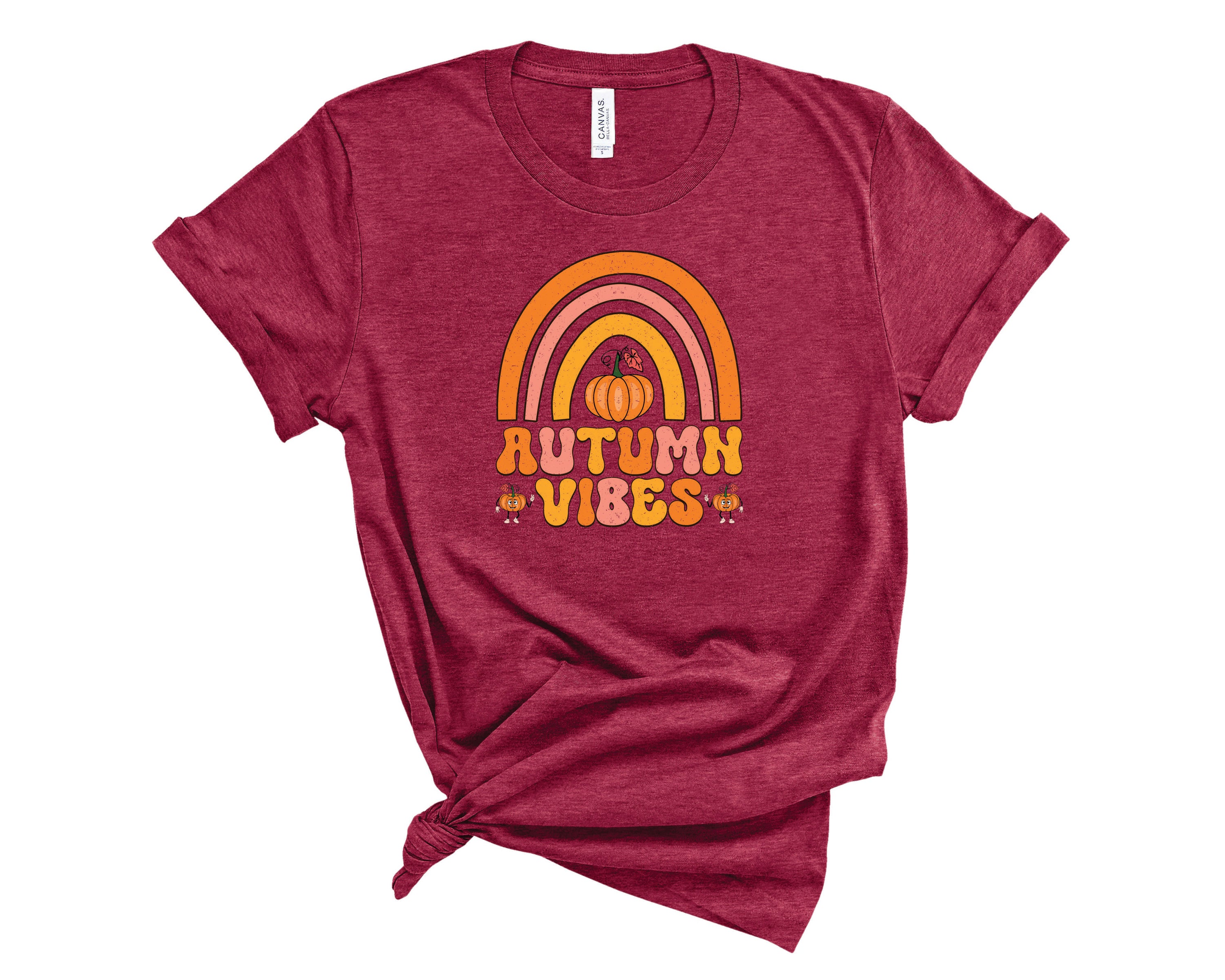 A unisex Autumn Vibes Graphic Tee featuring a colorful autumn-themed design, perfect for casual wear.