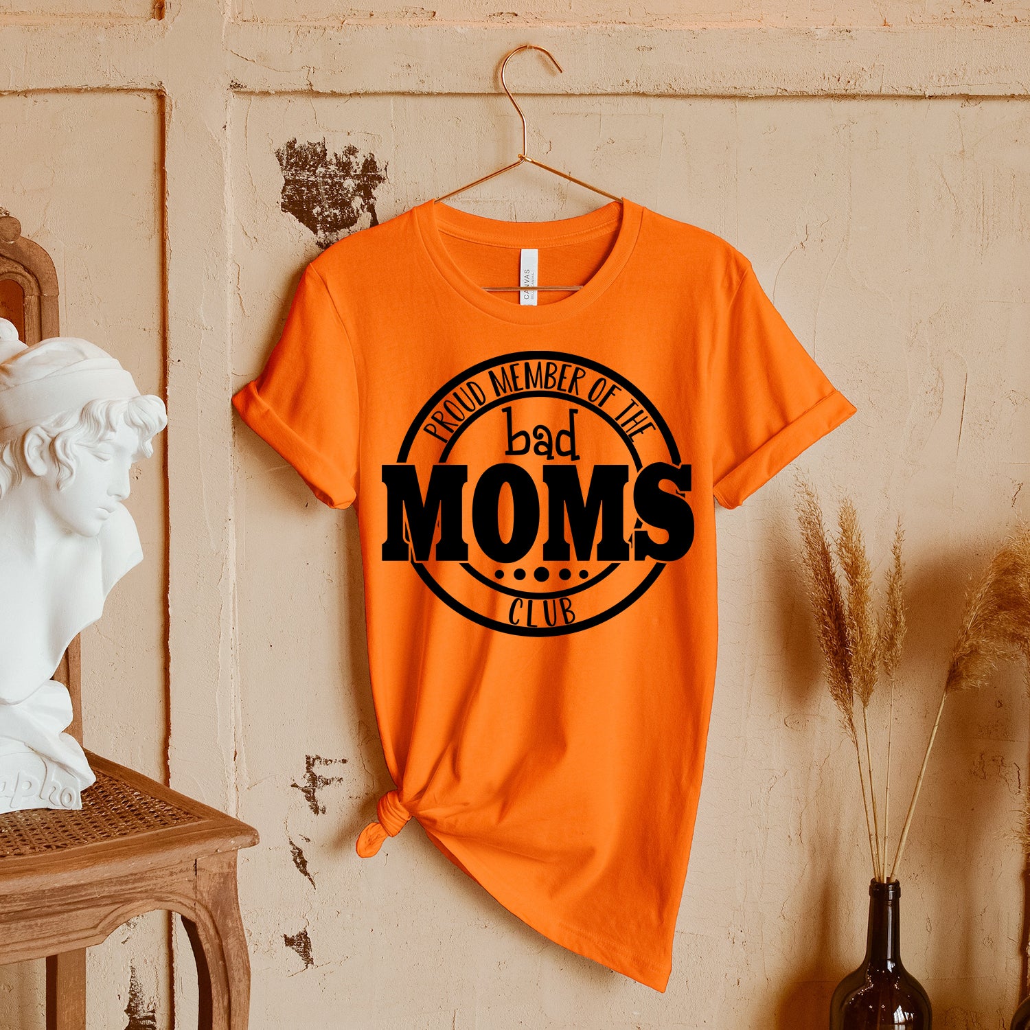Bad Moms Club Unisex T-shirt featuring vibrant graphic design, perfect for stylish moms.