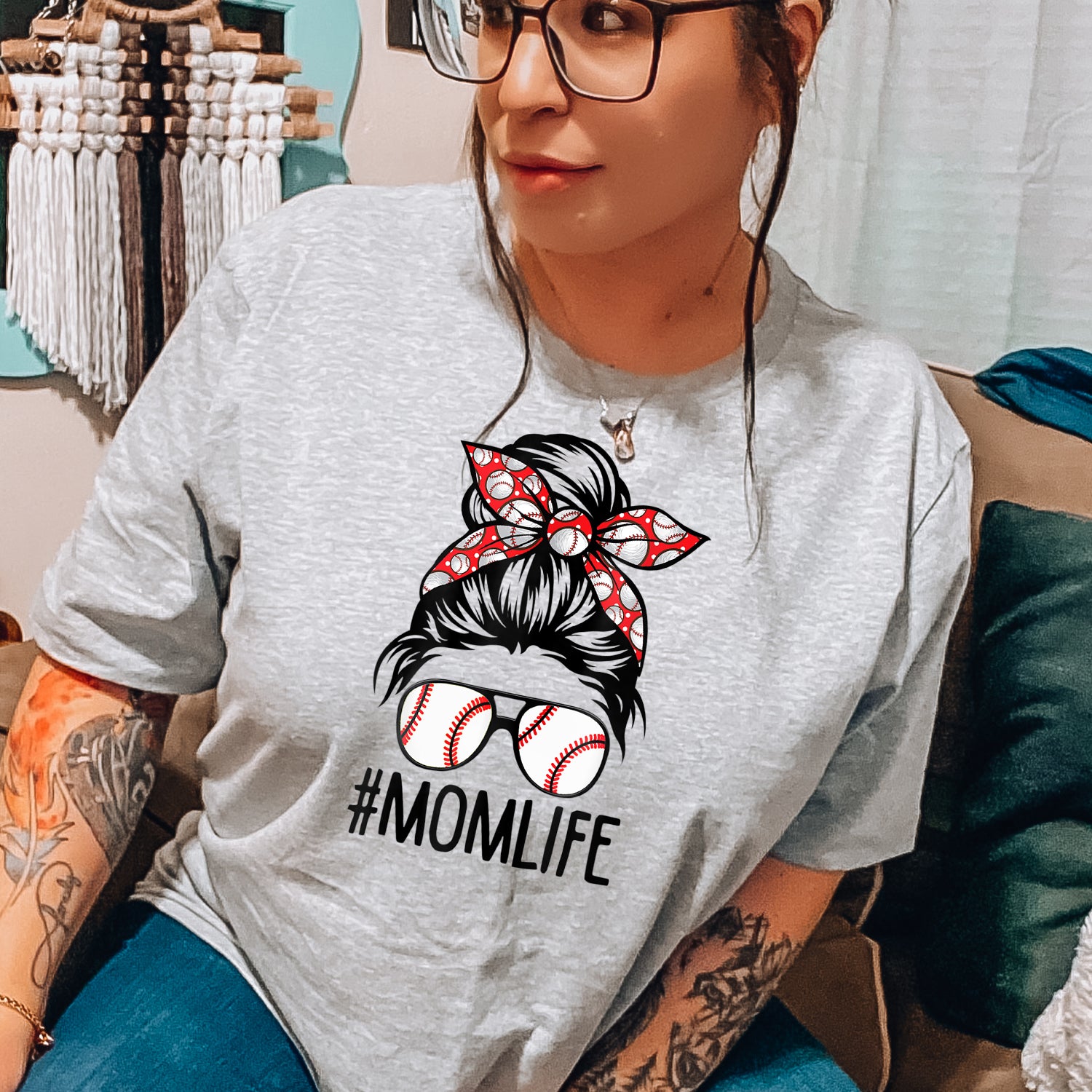 Baseball Mom Messy Bun Unisex T-shirt featuring a stylish messy bun graphic, perfect for game days.