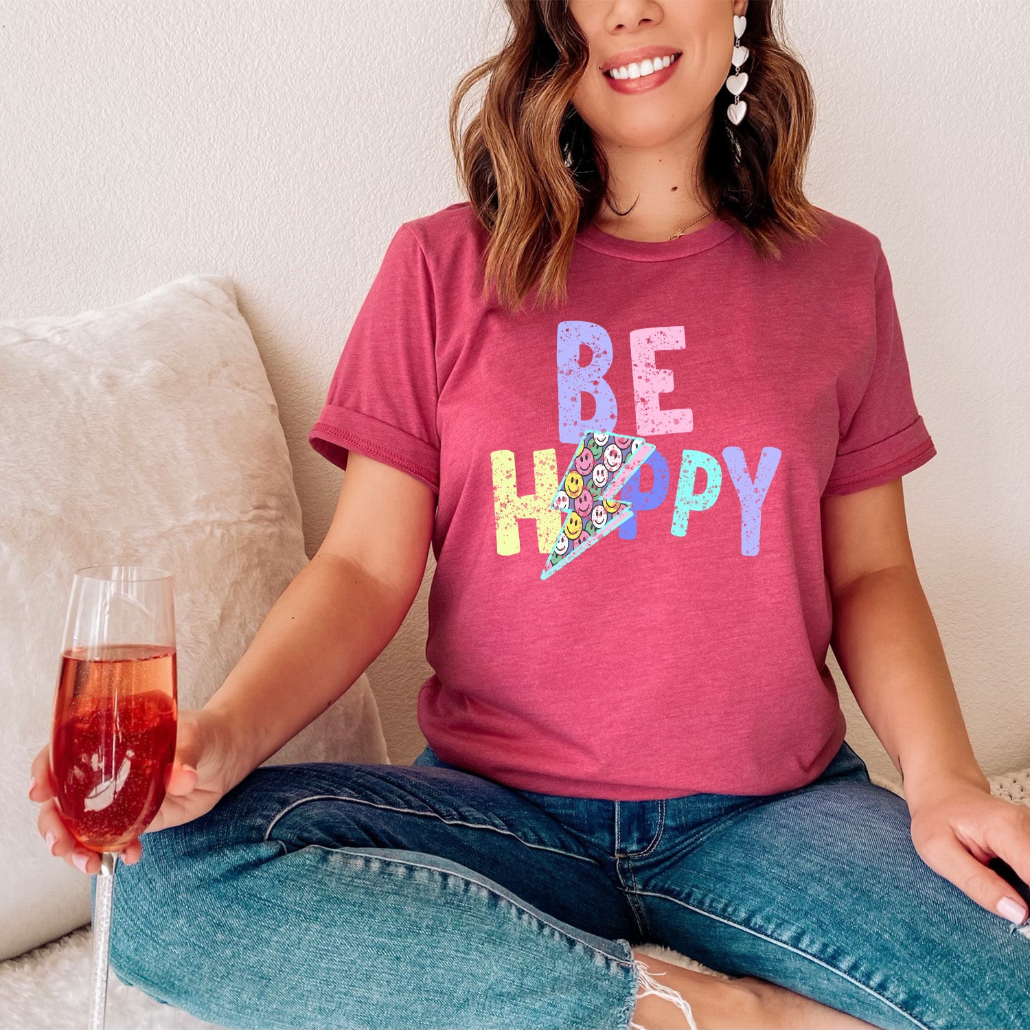 Be Happy Distressed Lightning Bolt Unisex T-shirt featuring a vibrant lightning bolt graphic on a soft fabric.