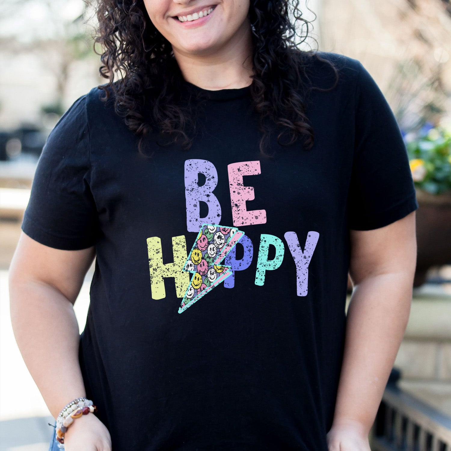 Be Happy Distressed Lightning Bolt Unisex T-shirt featuring a vibrant lightning bolt graphic on a soft fabric.