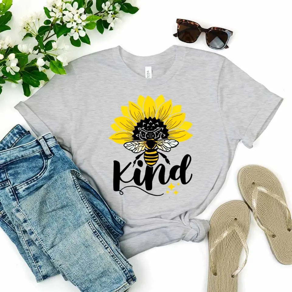 Bee Kind Sunflower Tee displayed on a mannequin, showcasing its soft fabric and vibrant sunflower design.
