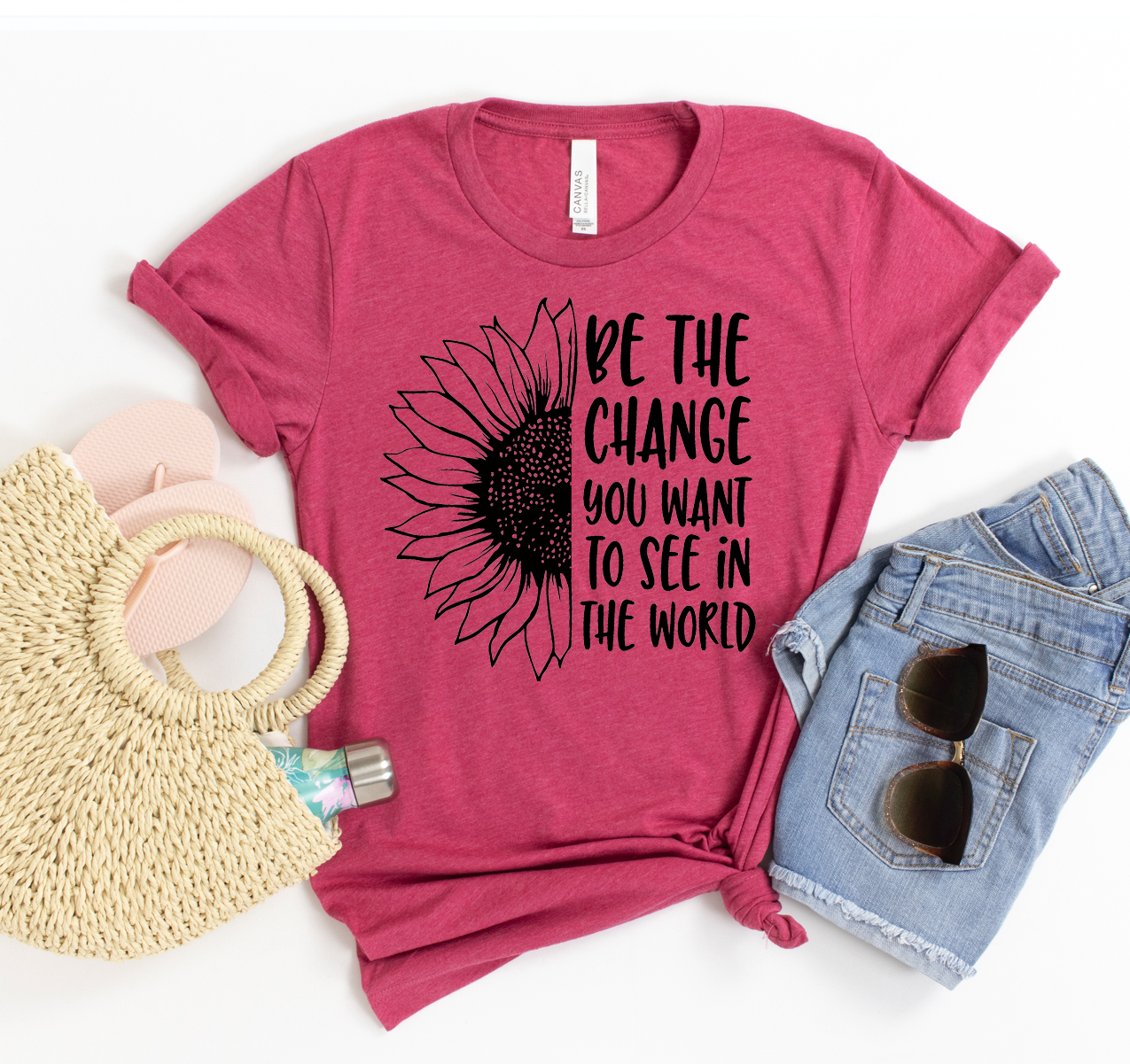 Be The Change T-shirt in various sizes, showcasing its unisex design and soft fabric.