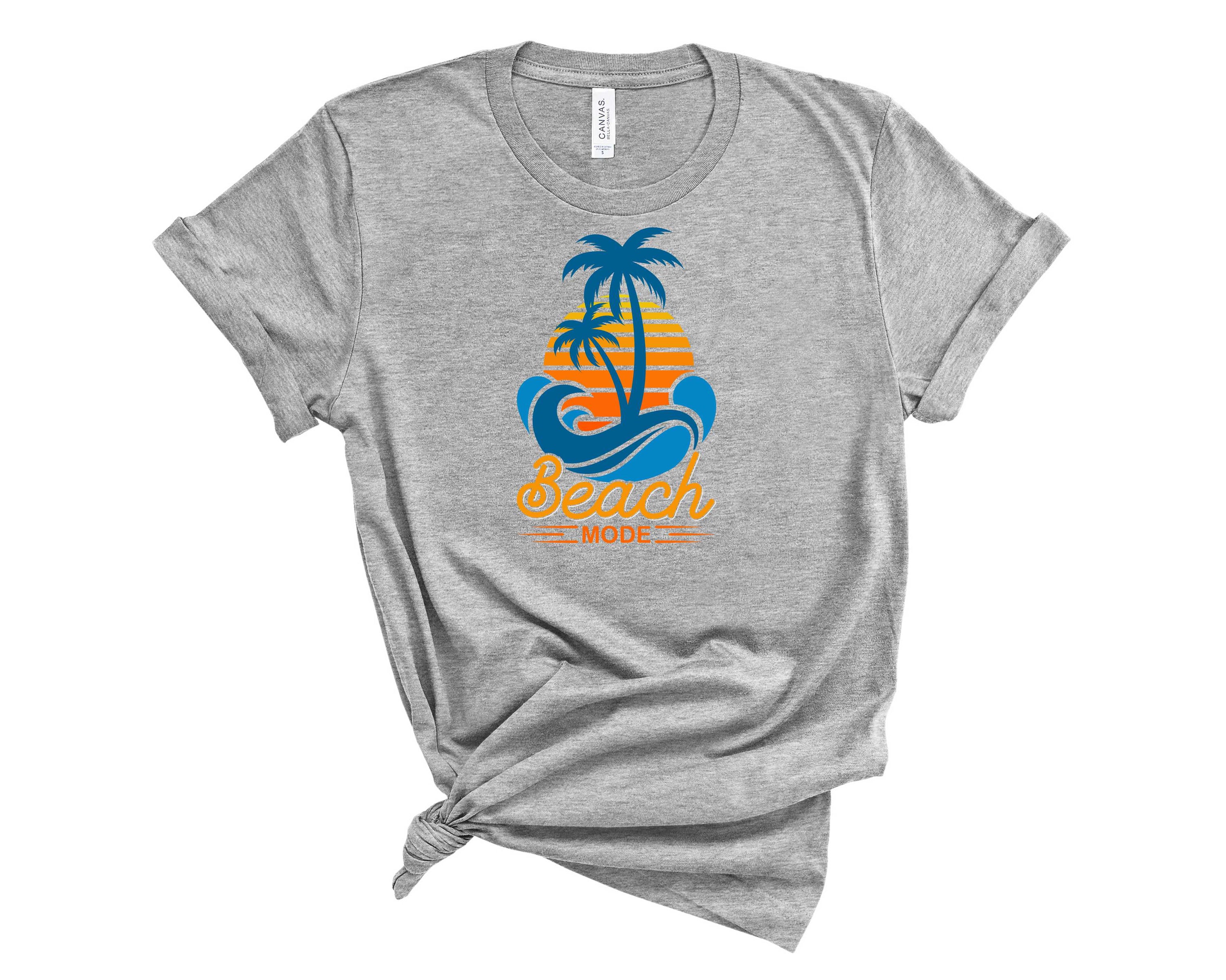 A stylish unisex Beach Mode Graphic Tee featuring a vibrant beach-themed design, perfect for summer outings.