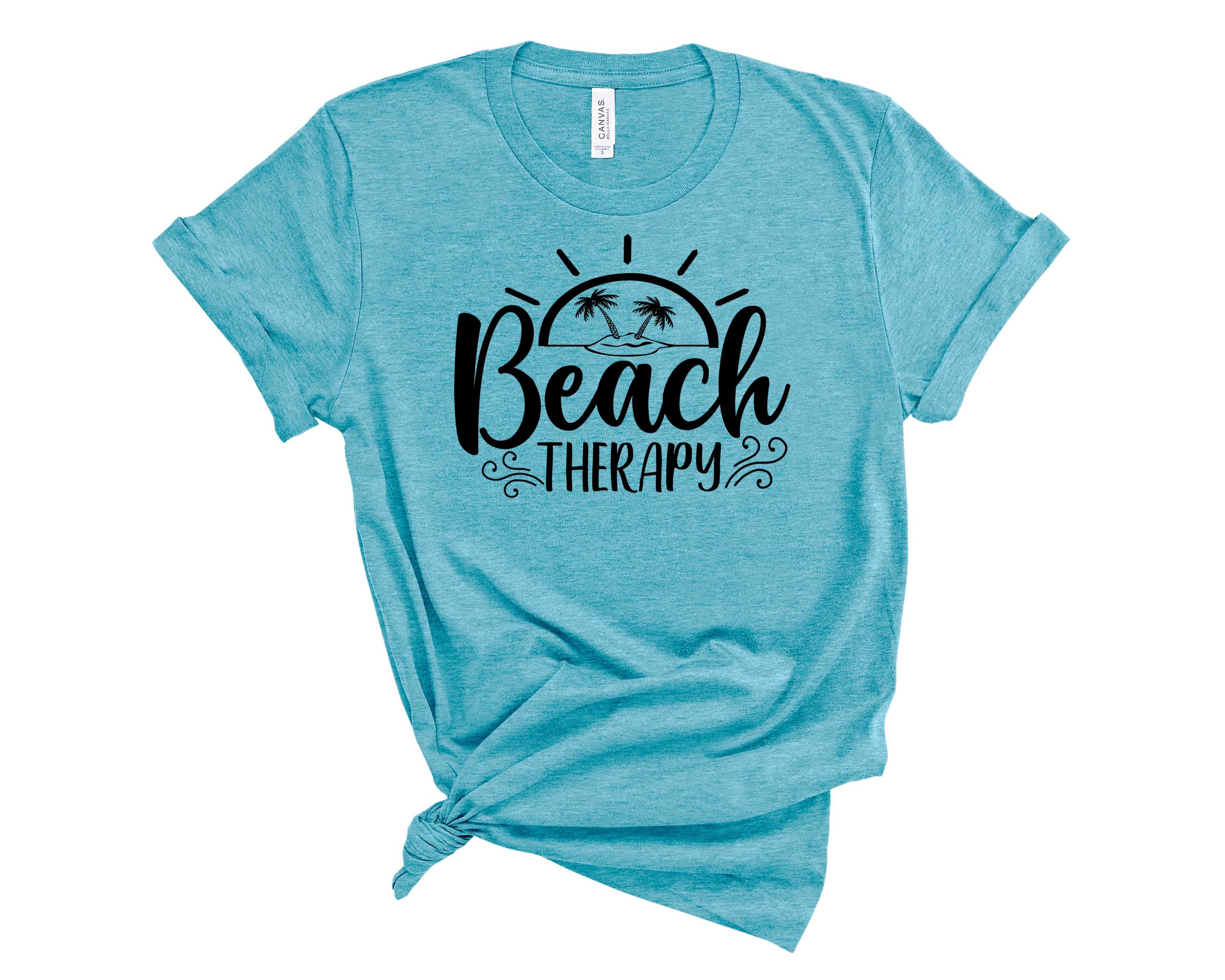 A unisex Beach Therapy Graphic Tee featuring a vibrant beach-themed design, perfect for casual wear.