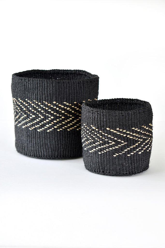 A set of two handwoven black sisal African planter and storage baskets, showcasing intricate patterns and natural fibers.