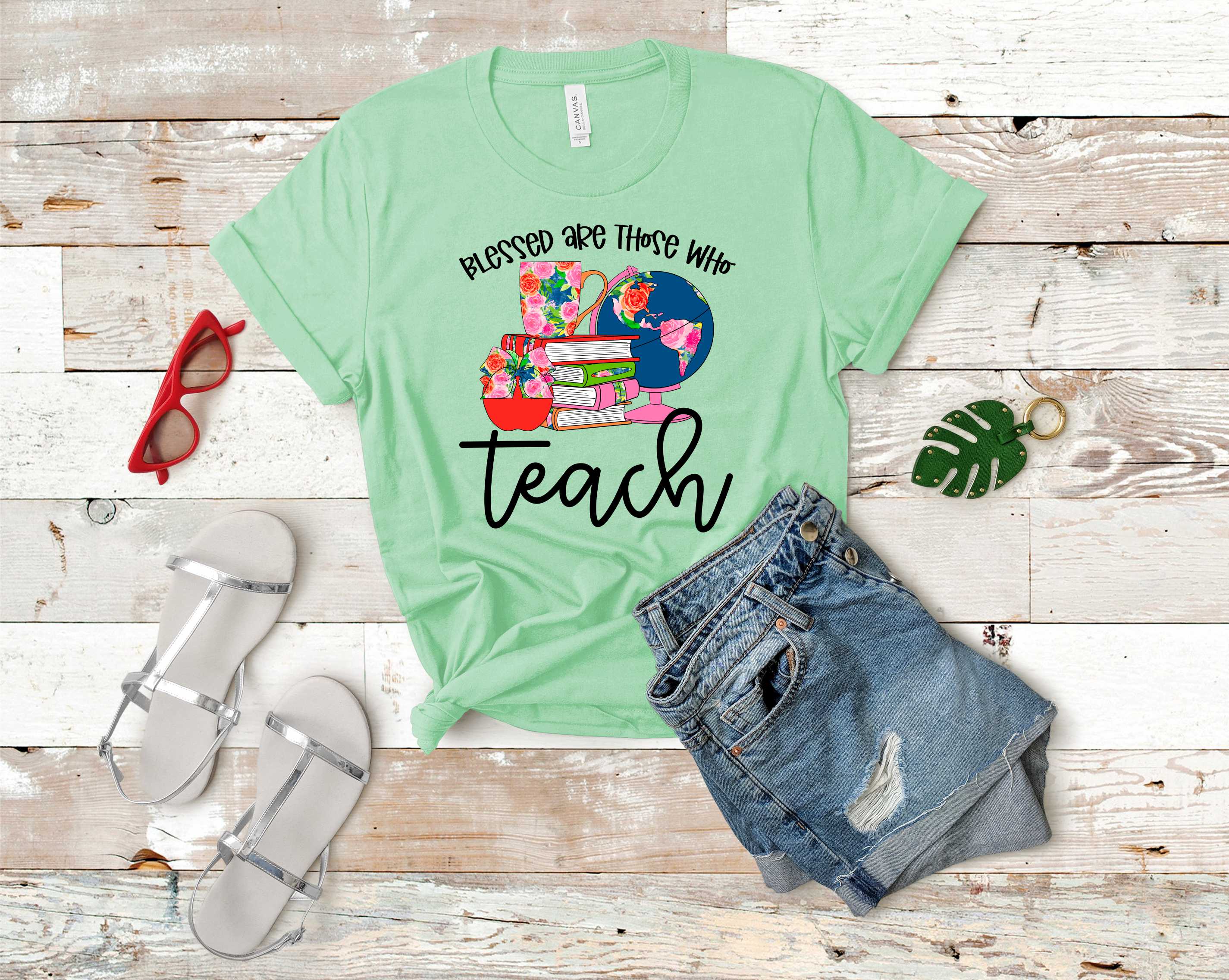 A unisex graphic tee featuring the phrase 'Blessed are those who teach' in stylish typography, perfect for educators.
