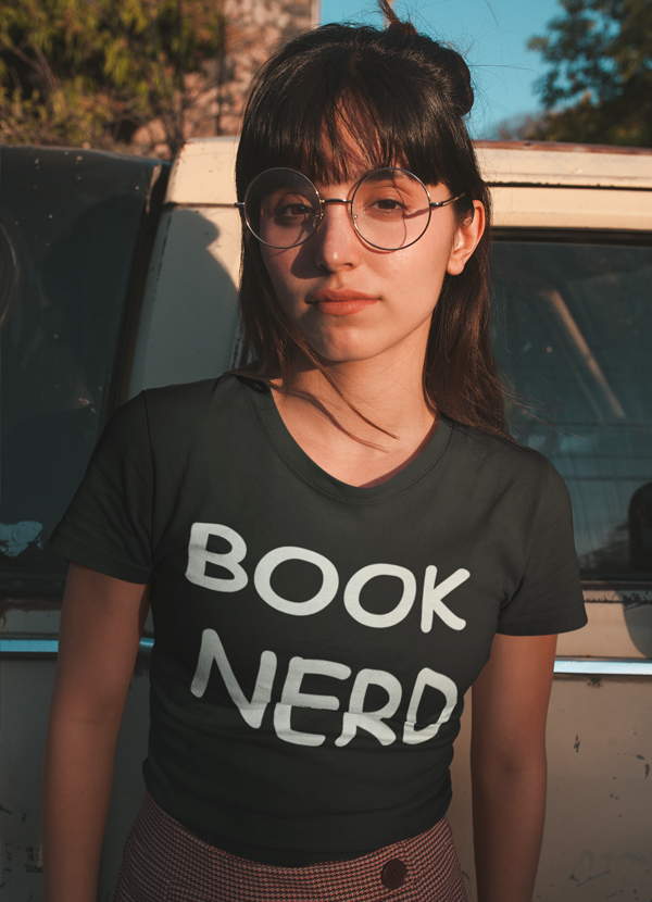A stylish Book Nerd Women T-shirt made from soft ringspun cotton, featuring unique designs by top artists, perfect for book lovers.