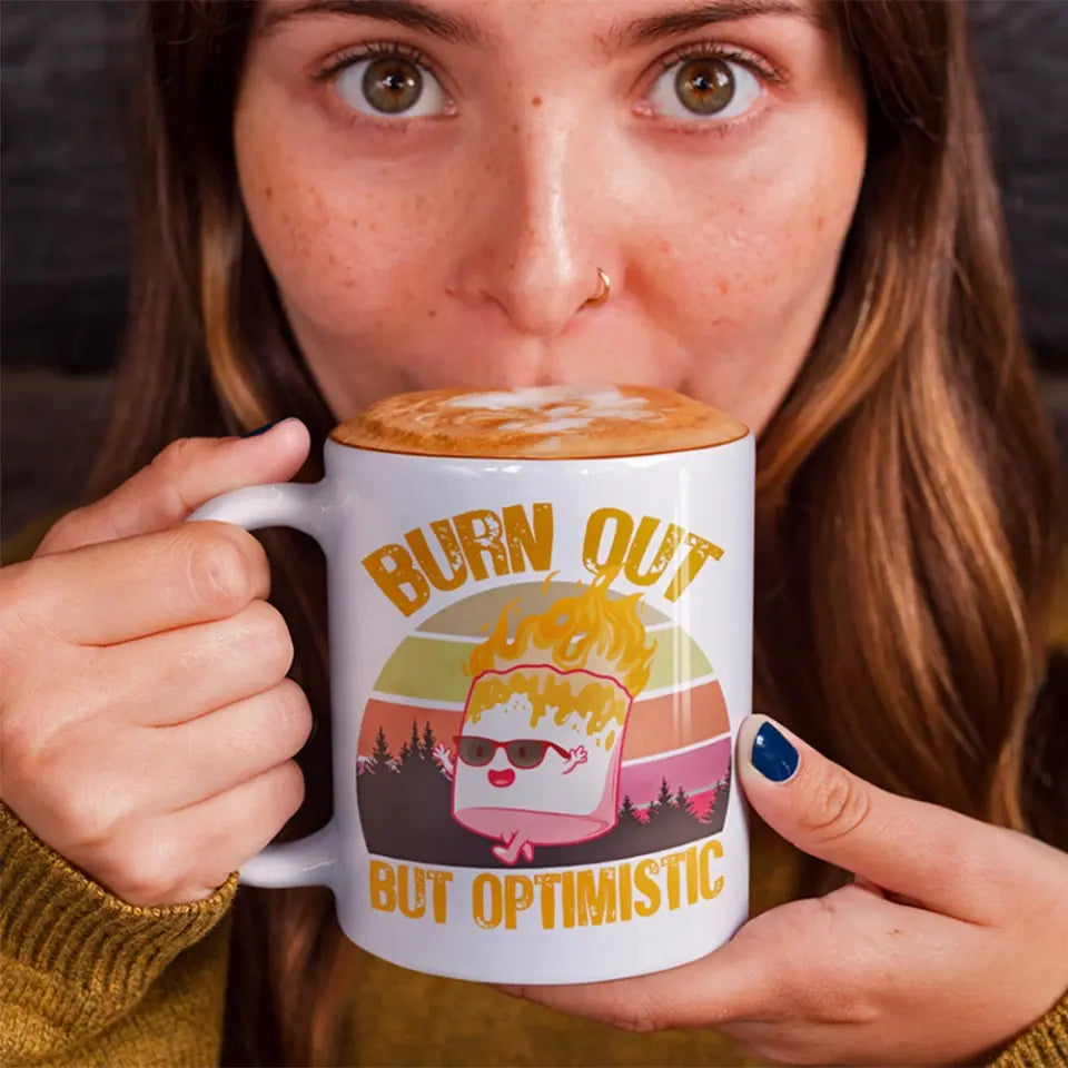 A colorful ceramic mug featuring a whimsical marshmallow design, perfect for hot and cold beverages.