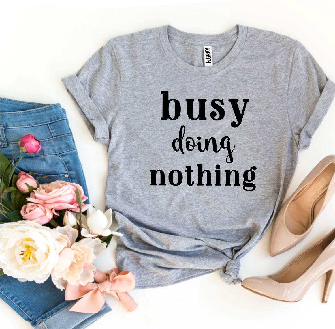 A stylish Busy Doing Nothing T-shirt made from premium ring spun cotton, featuring a soft feel and high-quality flex print design.
