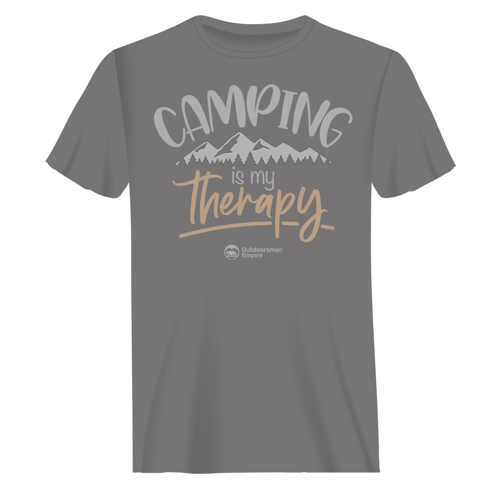 A comfortable unisex t-shirt featuring the phrase 'Camping Is My Therapy', perfect for outdoor enthusiasts.