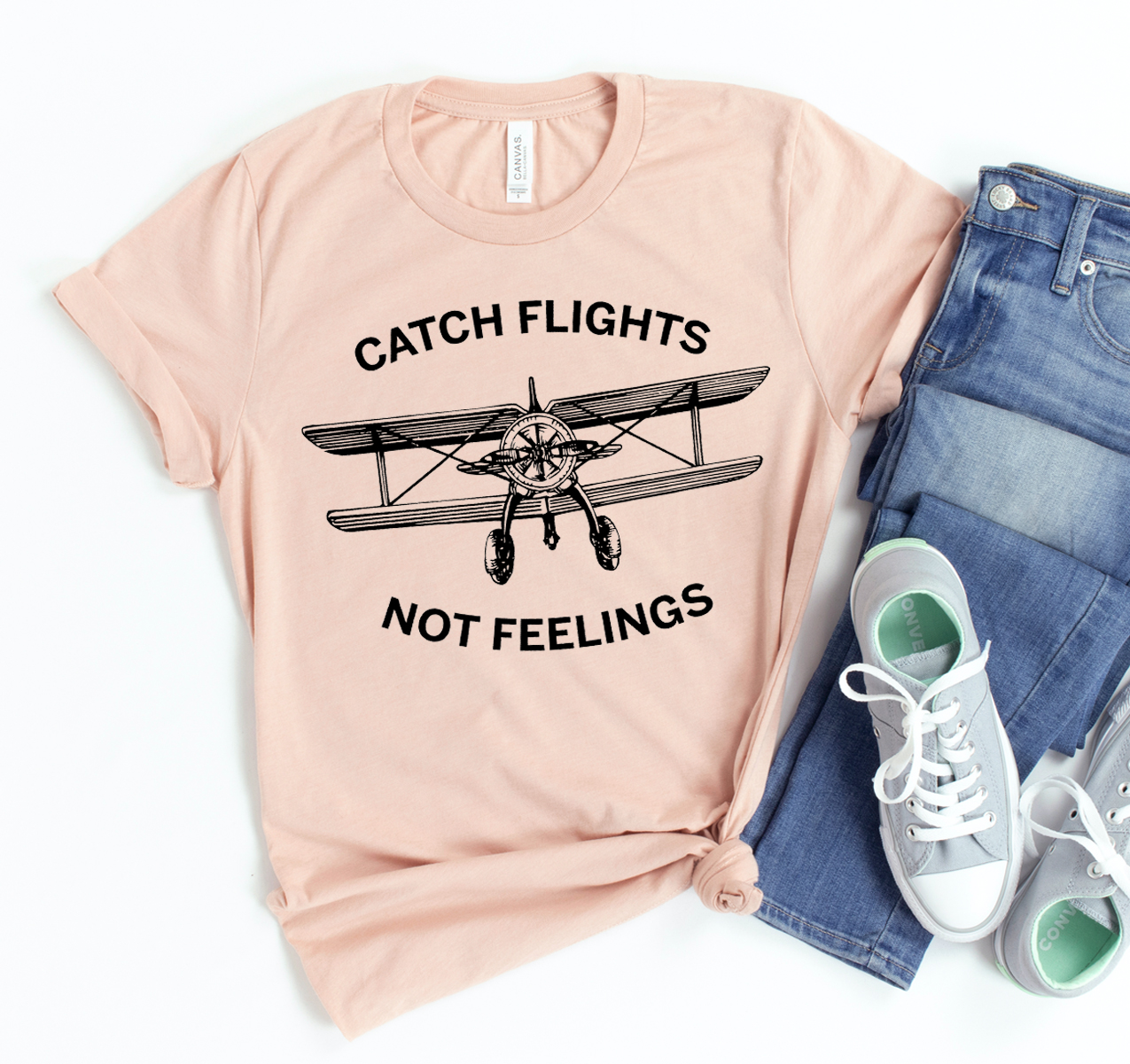 Catch Flights Not Feelings T-shirt in unisex design, made from soft airlume cotton, featuring a travel-inspired slogan.