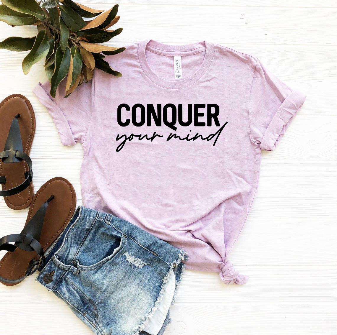 A stylish unisex Conquer Your Mind Shirt made from soft ring spun cotton, available in multiple colors and sizes.