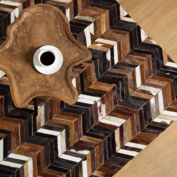 Handmade Cowhide Rug made from 100% genuine leather, showcasing unique patterns and textures, perfect for home decor.