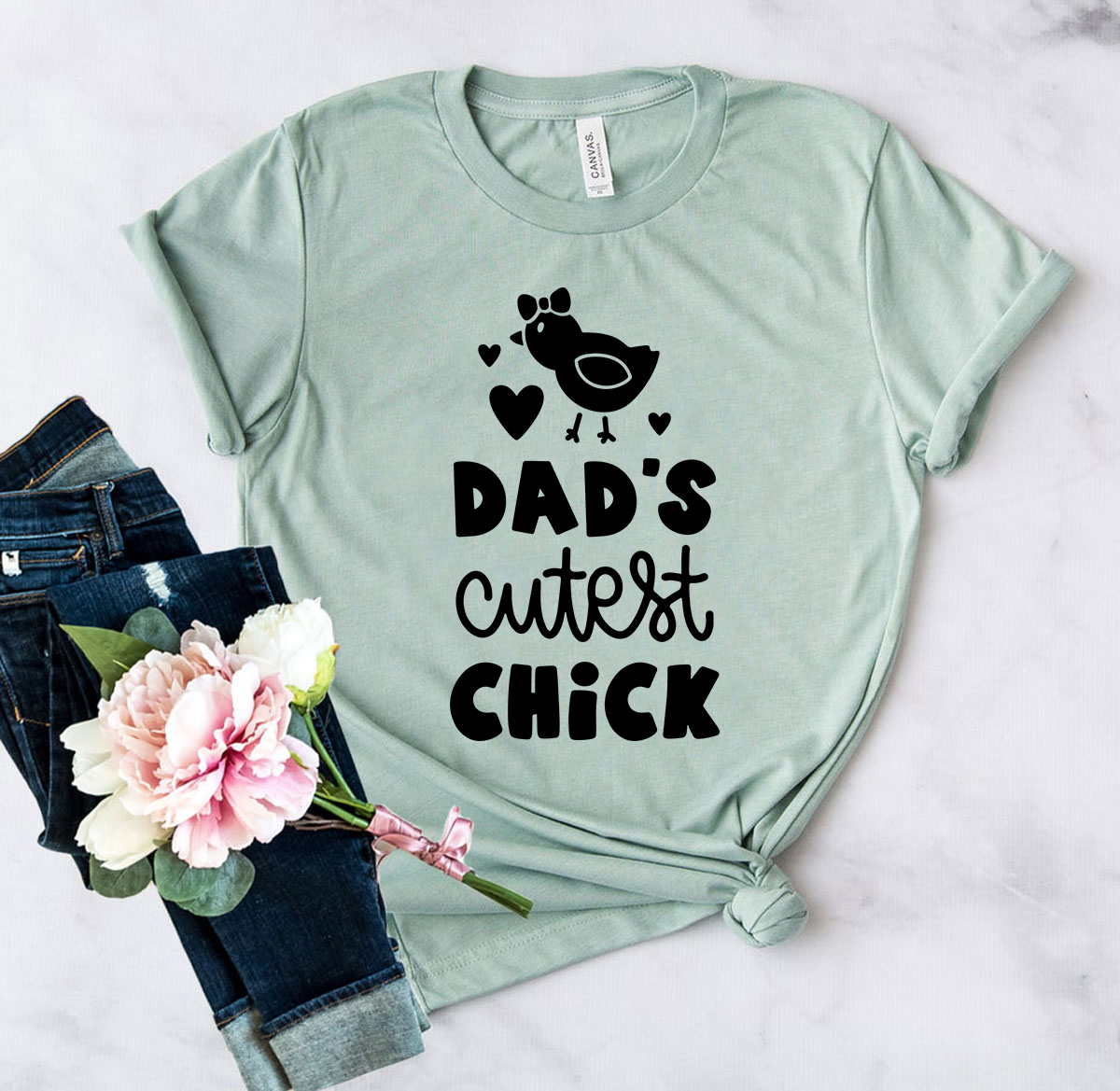 Dads Cutest Chick Shirt in various colors, showcasing its soft fabric and stylish design.