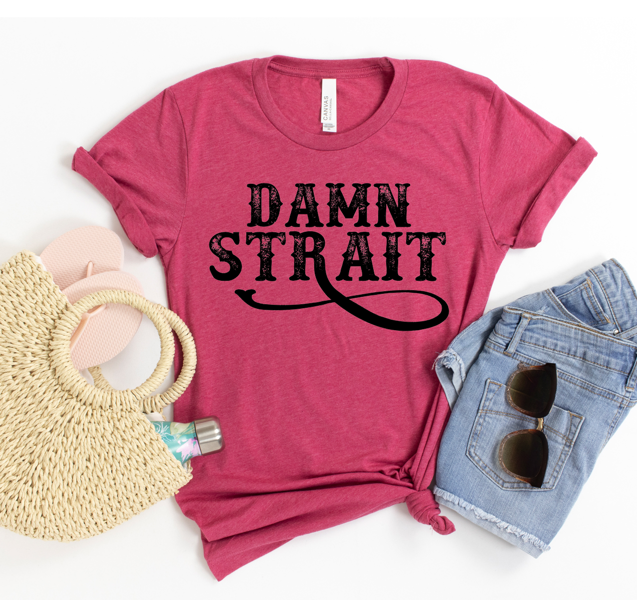 Damn Strait T-shirt in various sizes, showcasing its unisex design and soft fabric.