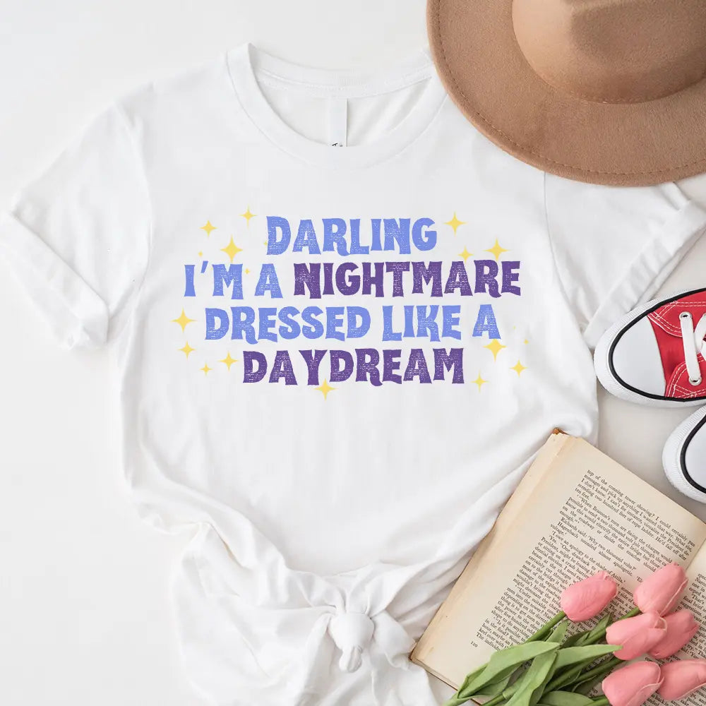 Darling I'm a Nightmare Dressed Like a Daydream T-shirt displayed on a mannequin, showcasing its unique design and comfortable fit.