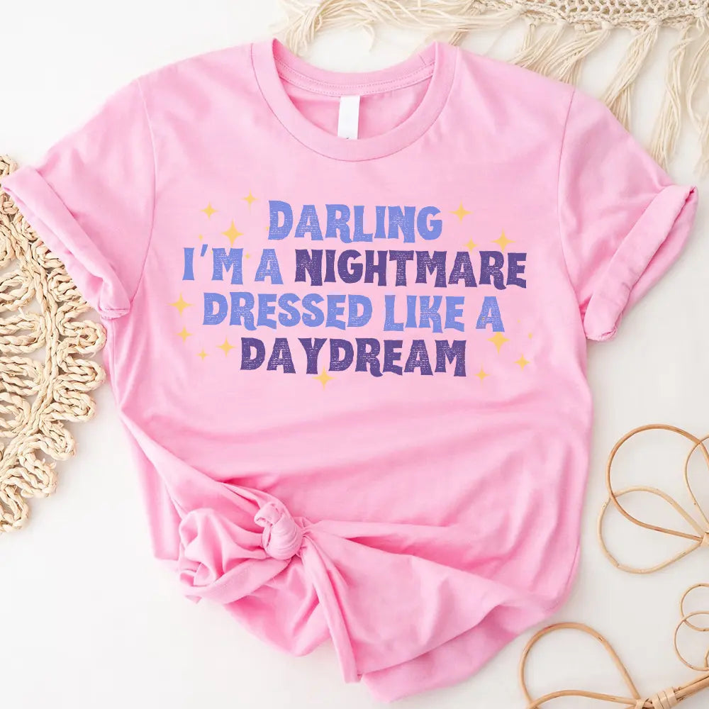 Darling I'm a Nightmare Dressed Like a Daydream T-shirt displayed on a mannequin, showcasing its unique design and comfortable fit.