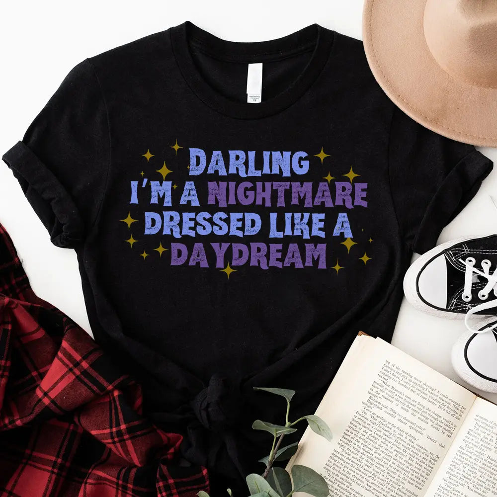 Darling I'm a Nightmare Dressed Like a Daydream T-shirt displayed on a mannequin, showcasing its unique design and comfortable fit.