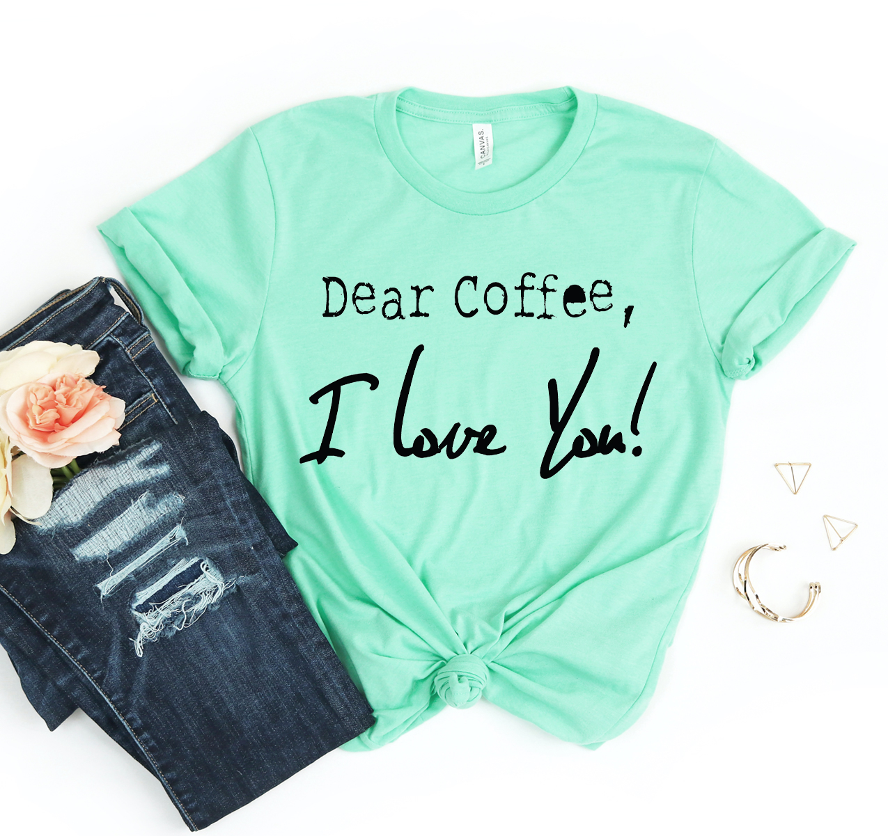 A stylish unisex Dear Coffee I Love You T-shirt displayed on a hanger, showcasing its soft fabric and trendy design.
