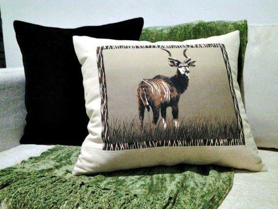 A vibrant African decorative throw pillow cover featuring unique handmade designs in high-quality cotton fabric, perfect for home decor.