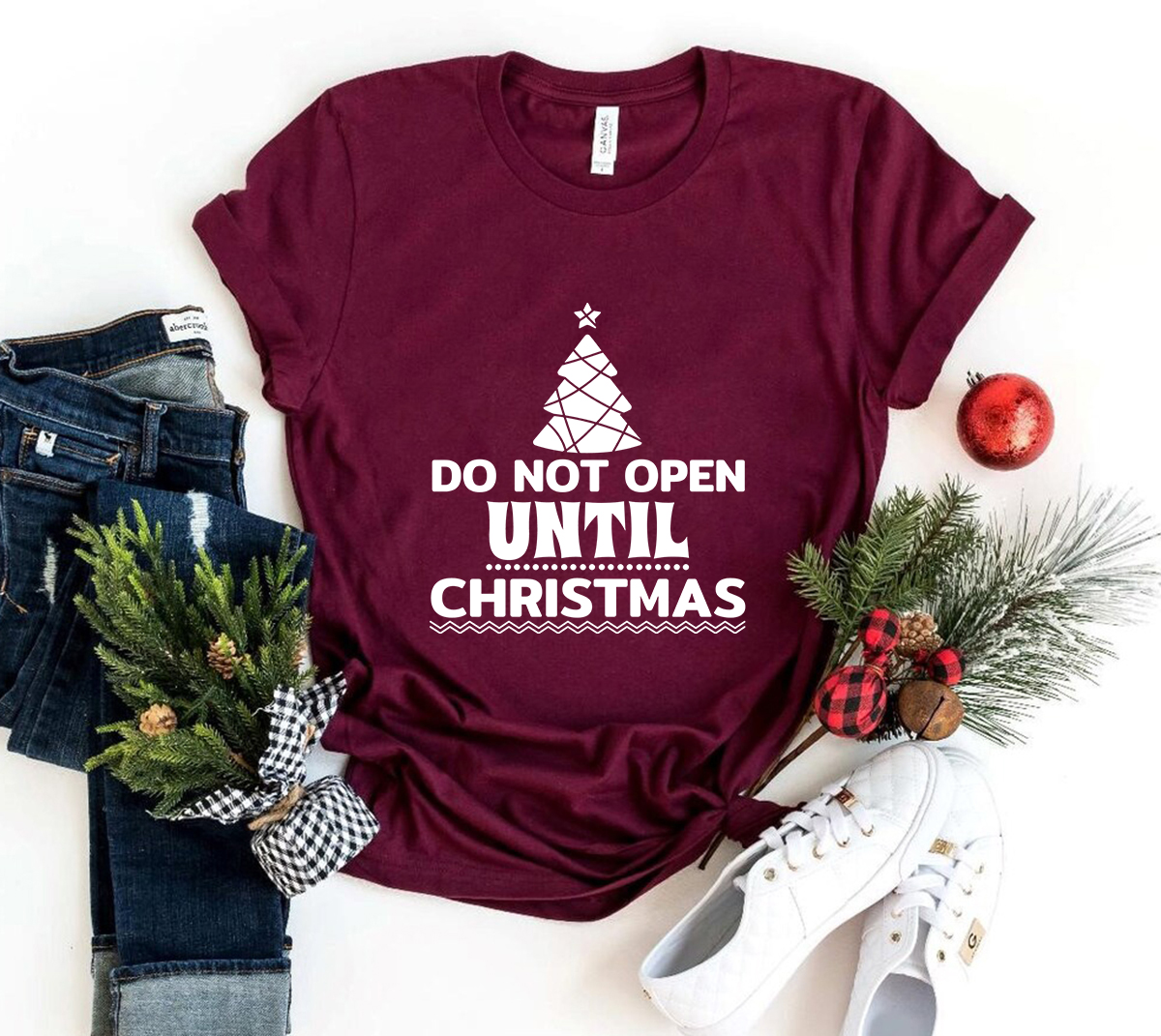 Unisex Do Not Open Until Christmas Shirt in various colors, showcasing a festive design perfect for holiday celebrations.
