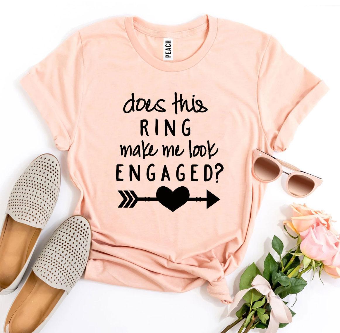 A stylish black T-shirt with the phrase 'Does This Ring Make Me Look Engaged?' printed in white, showcasing a humorous engagement theme.