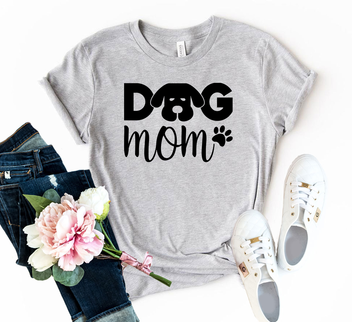 A stylish unisex Dog Mom Shirt made from soft ring spun cotton, available in various colors and sizes.