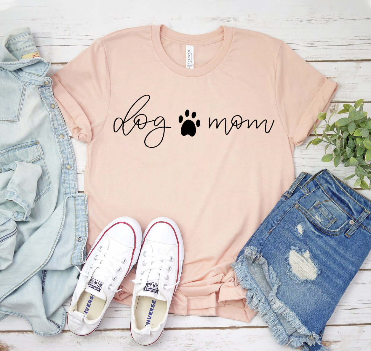 A stylish Dog Mom T-shirt made from soft cotton, featuring a classic unisex design suitable for all dog lovers.