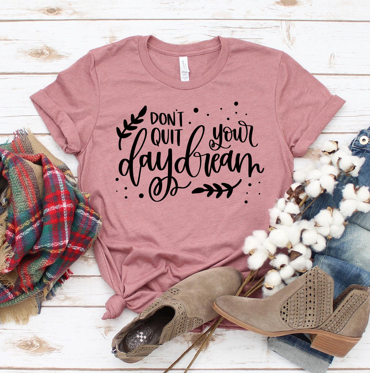 Don't Quit Your Daydream T-shirt made of premium ring spun cotton, featuring a motivational print and available in various sizes.