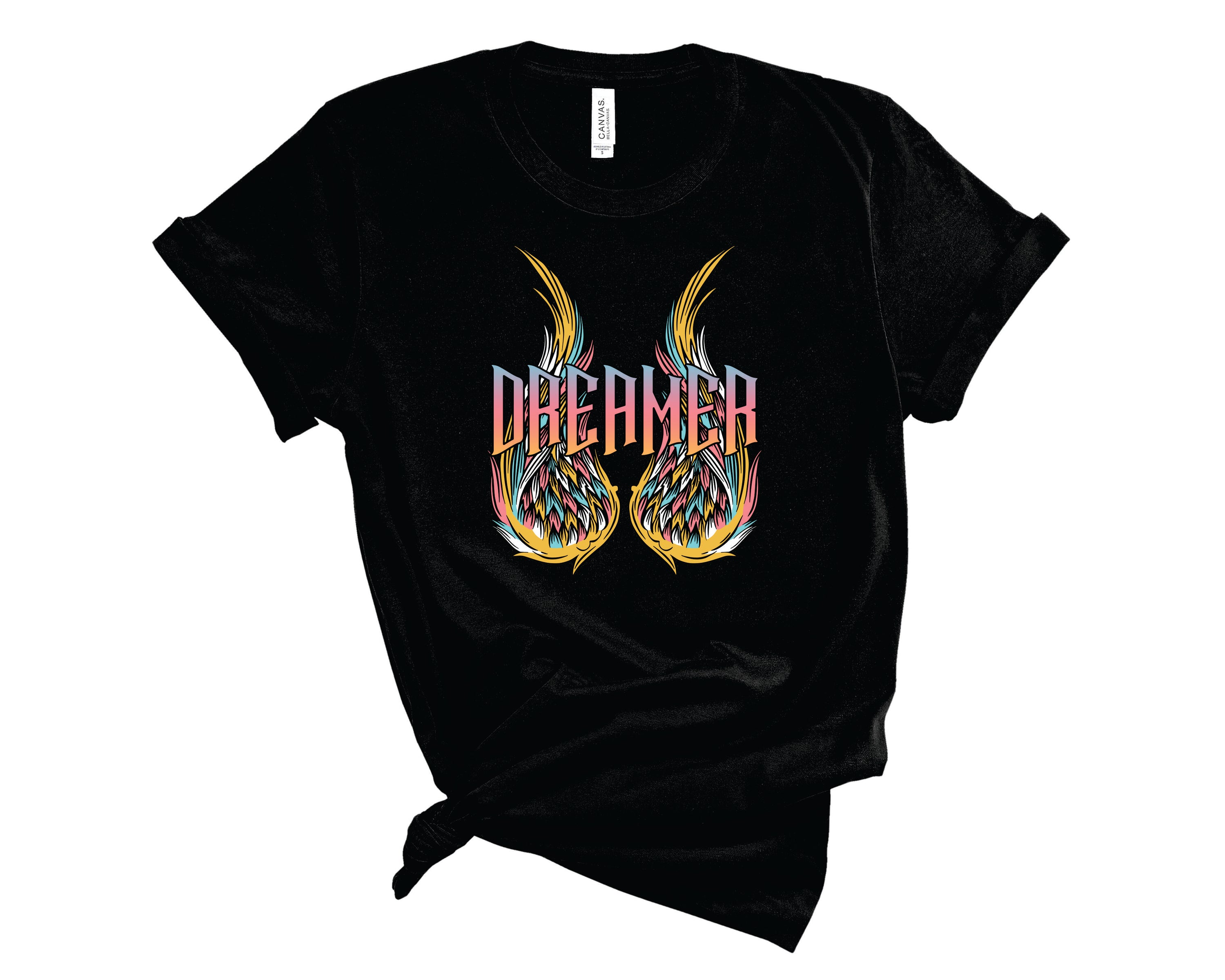 Dreamer Retro Wings Graphic Tee featuring a unique retro wings design on a soft unisex t-shirt.