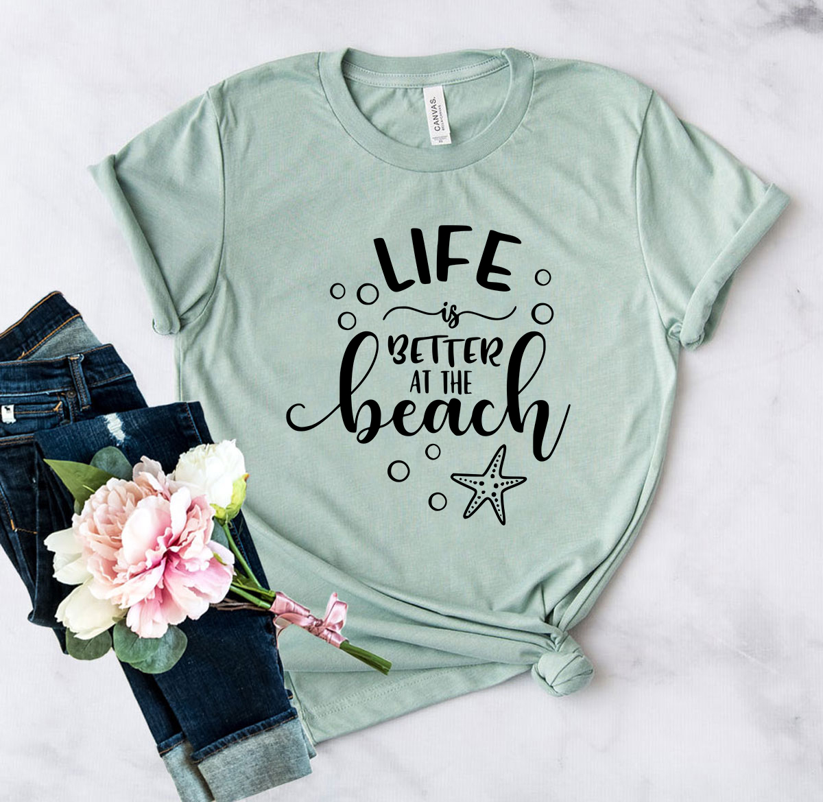 DT0105 Life Is Better At The Beach Shirt in various colors, showcasing its soft fabric and stylish design.