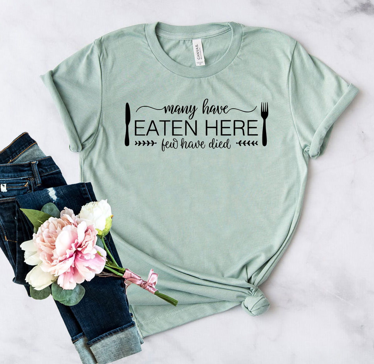 DT0119 Many Have Eaten Here Few Have Died Shirt displayed in multiple colors, showcasing its comfortable fabric and stylish design.
